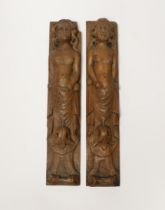 A pair of 17th century carved wood terminal figures, 39cm high