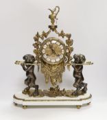 A period-style putti mantel clock (with key), 49cm high