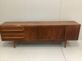 A mid century Danish teak sideboard by Erling Torvits, model 26, width 229cm, depth 44cm, height