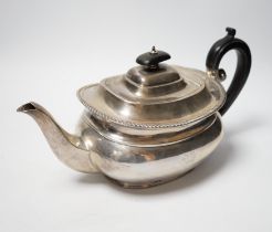 A George V silver teapot by Sebastian Garrard, London, 1927, gross weight 20.9oz.