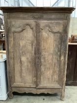 A 19th century French oak two door cupboard with painted interior, width 117cm, depth 55cm, height