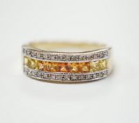 A modern 9ct gold, diamond, and two colour citrine? channel set half hoop ring, size P, gross weight