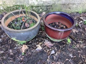 Two circular glazed earthenware garden planters, larger diameter 52cm, height 40cm, together with