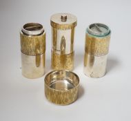A suite of four Elizabeth II parcel gilt silver condiments, comprising a cylindrical salt, pepper