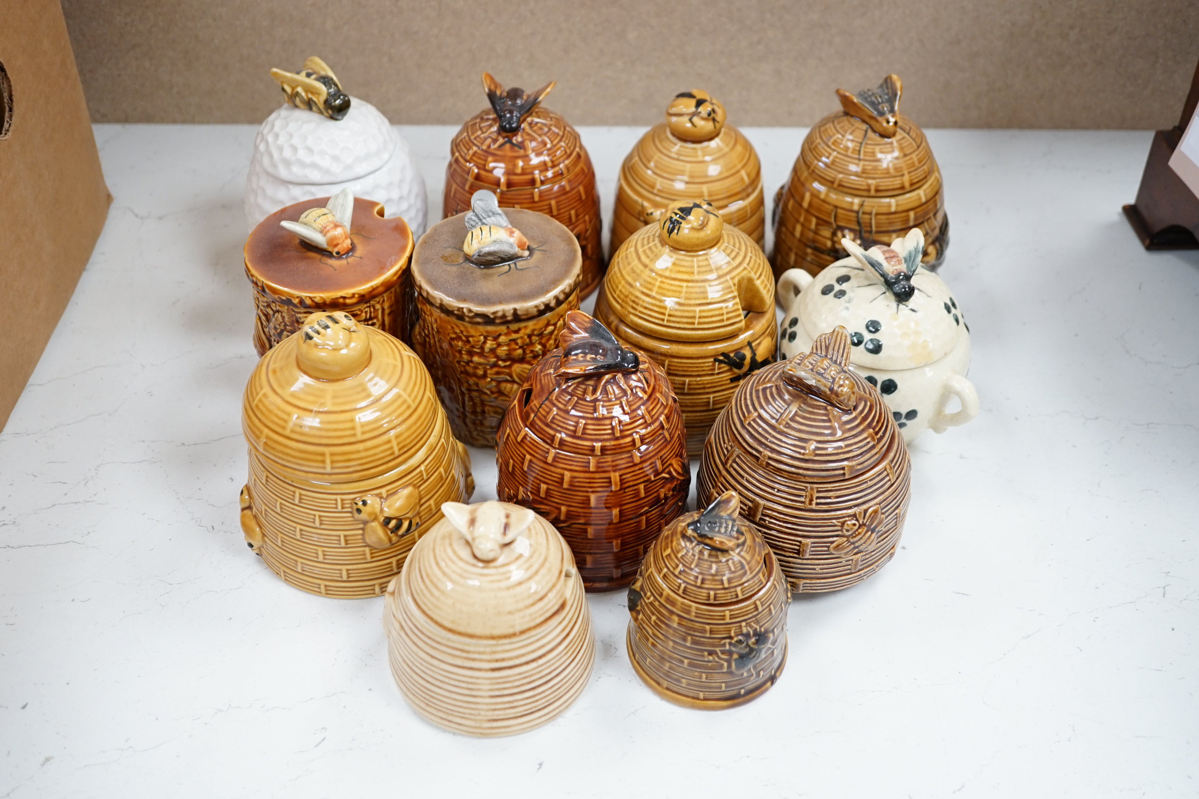 Thirteen various pottery honey jars and covers - Image 2 of 4