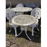 A Victorian style circular garden table, diameter 68cm, height 64cm and two chairs