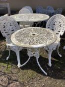 A Victorian style circular garden table, diameter 68cm, height 64cm and two chairs