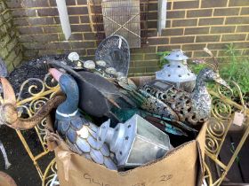 Assorted metal garden ornaments and lanterns