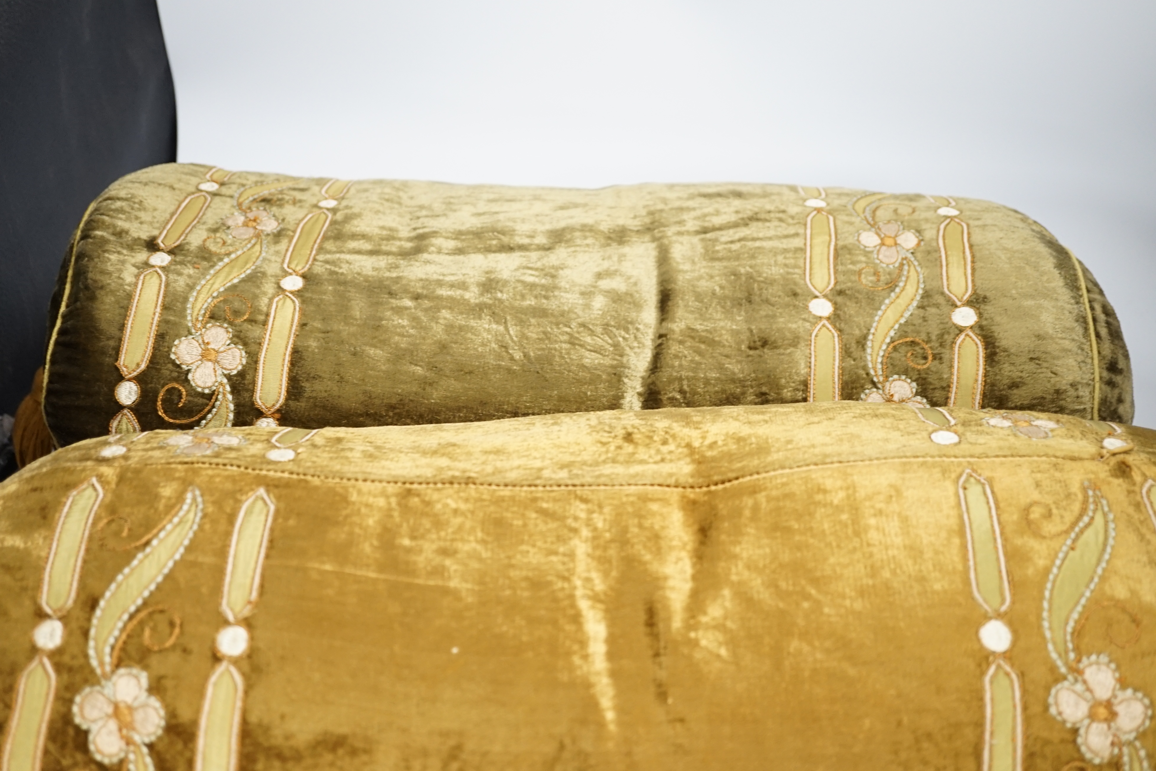 A pair of 20th century olive green silk velvet bolster cushions designed with appliqué, - Image 3 of 3