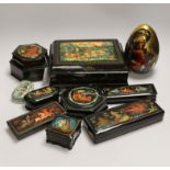 Nine Russian lacquer boxes including a two section hexagonal example and an egg, largest 25cm wide