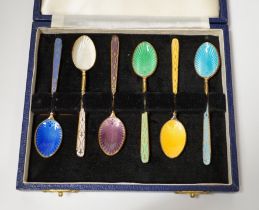 A cased set of six Elizabeth II silver gilt and polychrome enamelled coffee spoons, Turner &