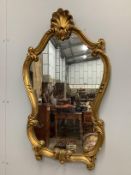 A Rococo style gilt composition wall mirror, width 54cm, height 93cm