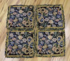 Four large woolwork cushion covers decorated with bouquets of flowers, 51 x 56cm