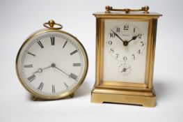 Two brass carriage timepieces; one with an alarm dial, the other in a drum case, tallest 11.5cm