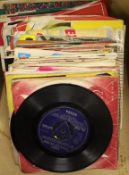 A collection of 45rpm 7 inch singles, artist include Elvis Presley, the Beatles, Creedence