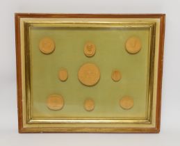 A framed set of nine grand tour medallions, 30x37cm total