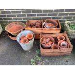 A quantity of assorted terracotta pots, largest diameter 40cm, height 28cm