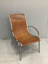 An aluminium and tan leather armchair in the manner of Rodolf Szedleczky (seat in need of repair),