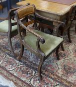 A set of eight Regency mahogany and satinwood banded sabre leg dining chairs, two with arms