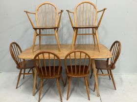 An Ercol rectangular elm and beech dining table, width 152cm, depth 84cm, height 71cm together