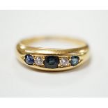 A George V 18ct gold, three stone sapphire and two stone diamond set half hoop ring, size N, gross