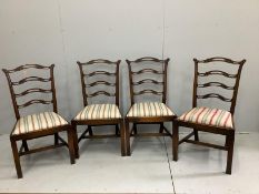 A set of four George III style mahogany pierced ladder back dining chairs (one a/f), width 54cm,