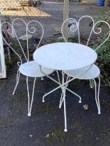 A circular metal garden table, diameter 54cm, height 69cm and two chairs