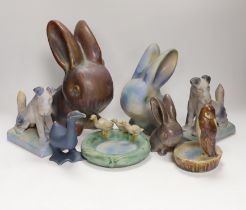 Collection of Bourne Denby animals including rabbits and a pair of dogs, tallest 27cm
