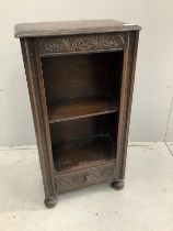 A small 17th century style oak open bookcase, width 48cm, depth 28cm, height 91cm