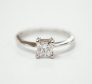 A white metal and princess cut solitaire diamond set ring, the stone weighing 0.50ct, size K,