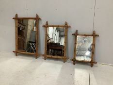 A graduated set of three French rectangular faux bamboo wall mirrors, largest width 63cm, height