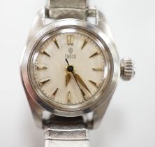 A lady's stainless steel Tudor manual wind wrist watch, with baton numerals, on an associated