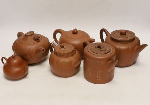 Six Chinese Yixing terracotta teapots, largest 11cm