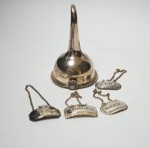 A George IV silver wine funnel, London, 1825, 12.9cm and four George III silver wine labels