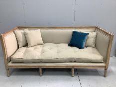 A Contemporary bleached wood and natural fabric settee, width 190cm, depth 80cm, height 83cm