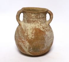An intact Roman terracotta two handled jar, 17.5cm high