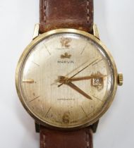 A gentleman's 9ct gold Marvin automatic wrist watch, with date aperture, on a leather strap.