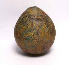 A Pre-Columbian style ovoid earthenware vase, 26cm high