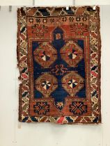 An antique Caucasian blue ground rug, 160 x 115cm