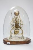 A late 19th century skeleton clock, under glass dome, 44cm high .