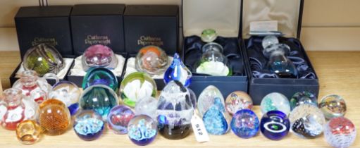 A collection of mostly Caithness glass paperweights, 1980s-2000s, with various boxes