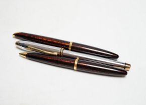 A Watermans fountain pen and propelling pencil and a Cross fountain pen