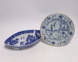 An 18th century delftware plate and blue and white pearlware plate, largest 28cm wide