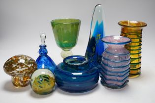 A group of Mdina glass comprising three vases, a stemmed glass, three paper weights and a scent
