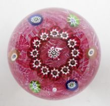 A Paul Ysart millefiori garland glass paperweight, Harland period, ‘H’ cane, with scrambled pink