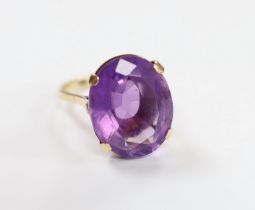 A 9ct and single stone oval cut amethyst set dress ring, size R/S, gross weight 7.5 grams.