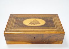 A late 19th century walnut sewing box, inlaid with a Napoleonic sea fort to a central cartouche on