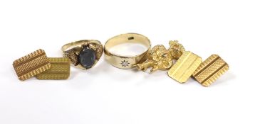 A pair of engine turned 9ct gold cufflinks, a 9ct 'Lincoln Imp' brooch and two 9ct rings including