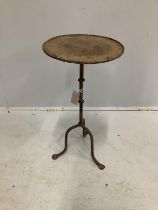 A circular wrought iron tripod wine table, diameter 31cm, height 60cm