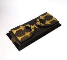A Victorian Betjemann’s patent coromandel and gilt brass book slide, central plaque engraved ‘F.